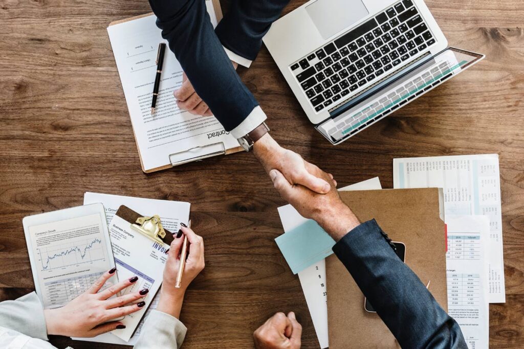 handshake over a table